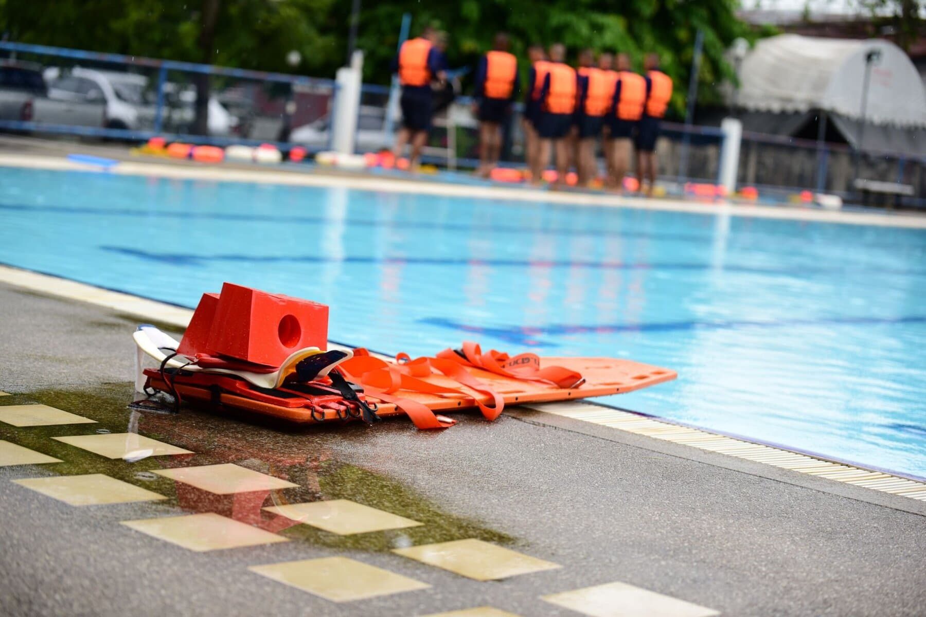 Spinal board placed on the edge of a pool