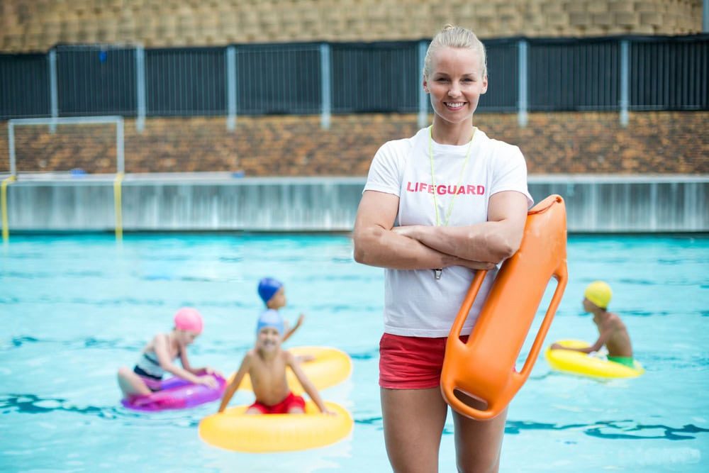 Lifeguard Walking with Rescue Buoy