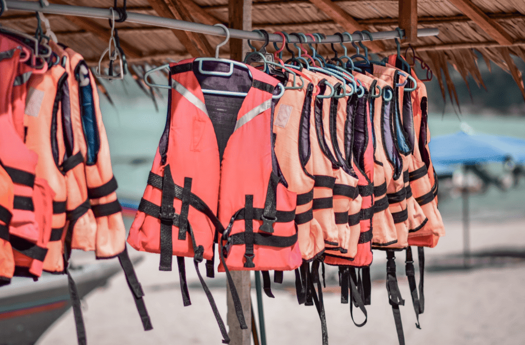 Life jackets hanging on a rack